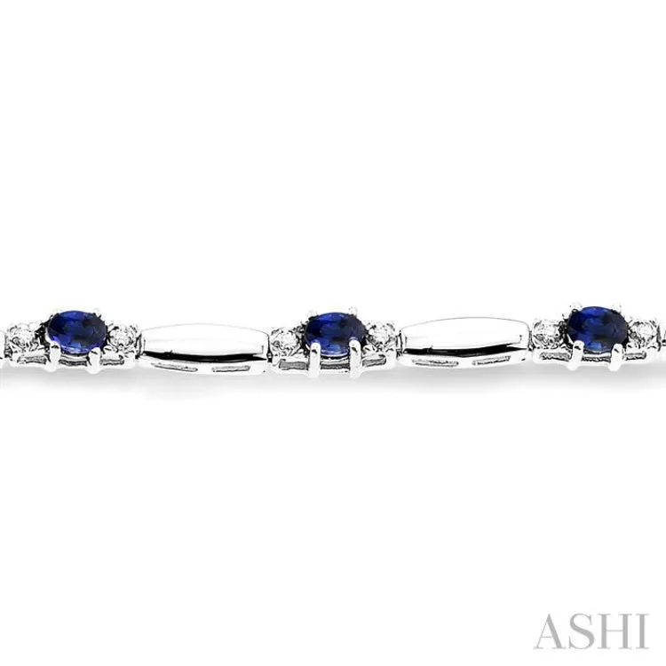 1/10 Ctw Bar and Oval Mount Round Cut Diamond & 5x3MM Oval Cut Sapphire Precious Bracelet in 10K White Gold