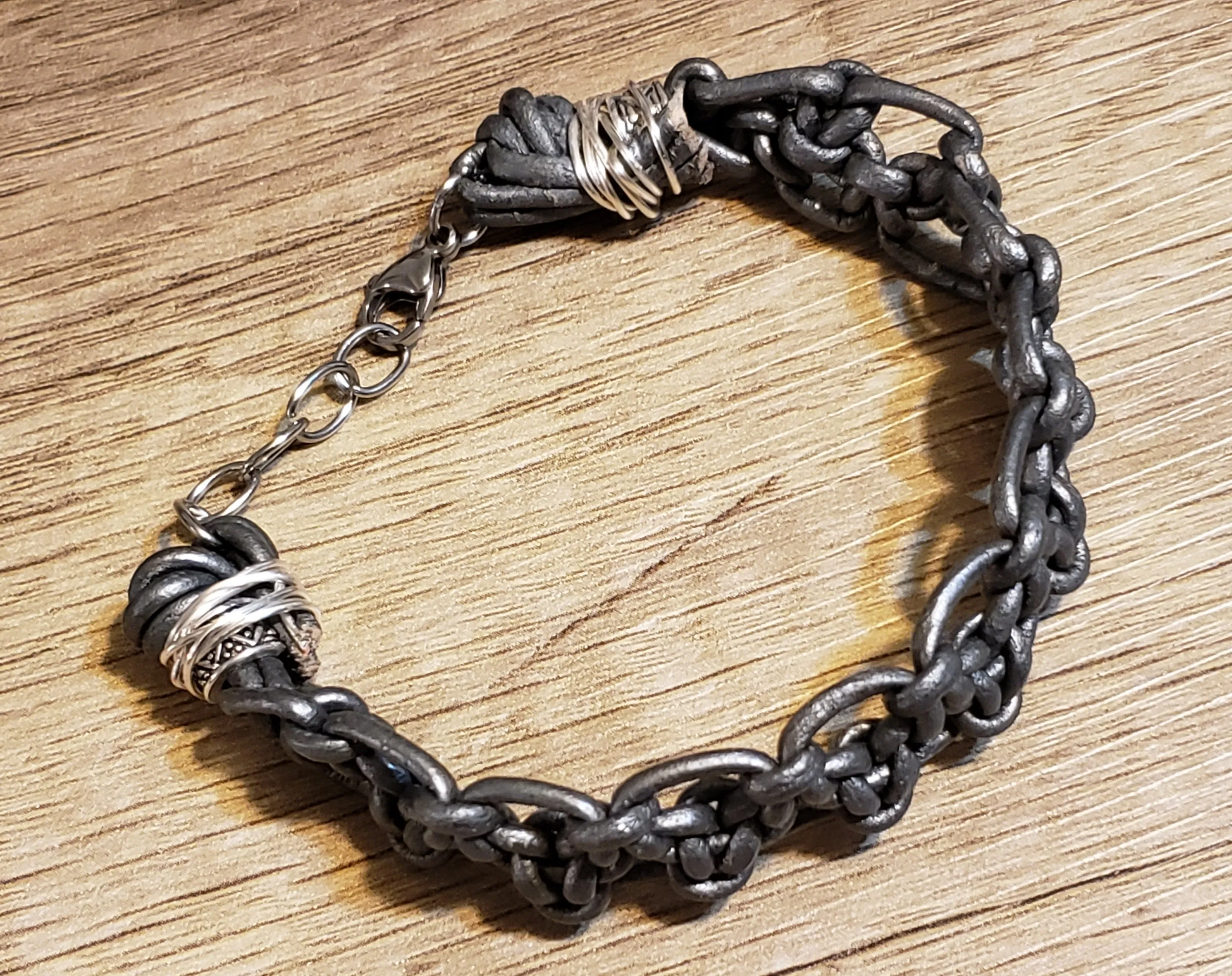 Metallic Gray Leather & Stainless Steel Chain Bracelet, Adjustable up to 9" with Lobster Claw Clasp.
 