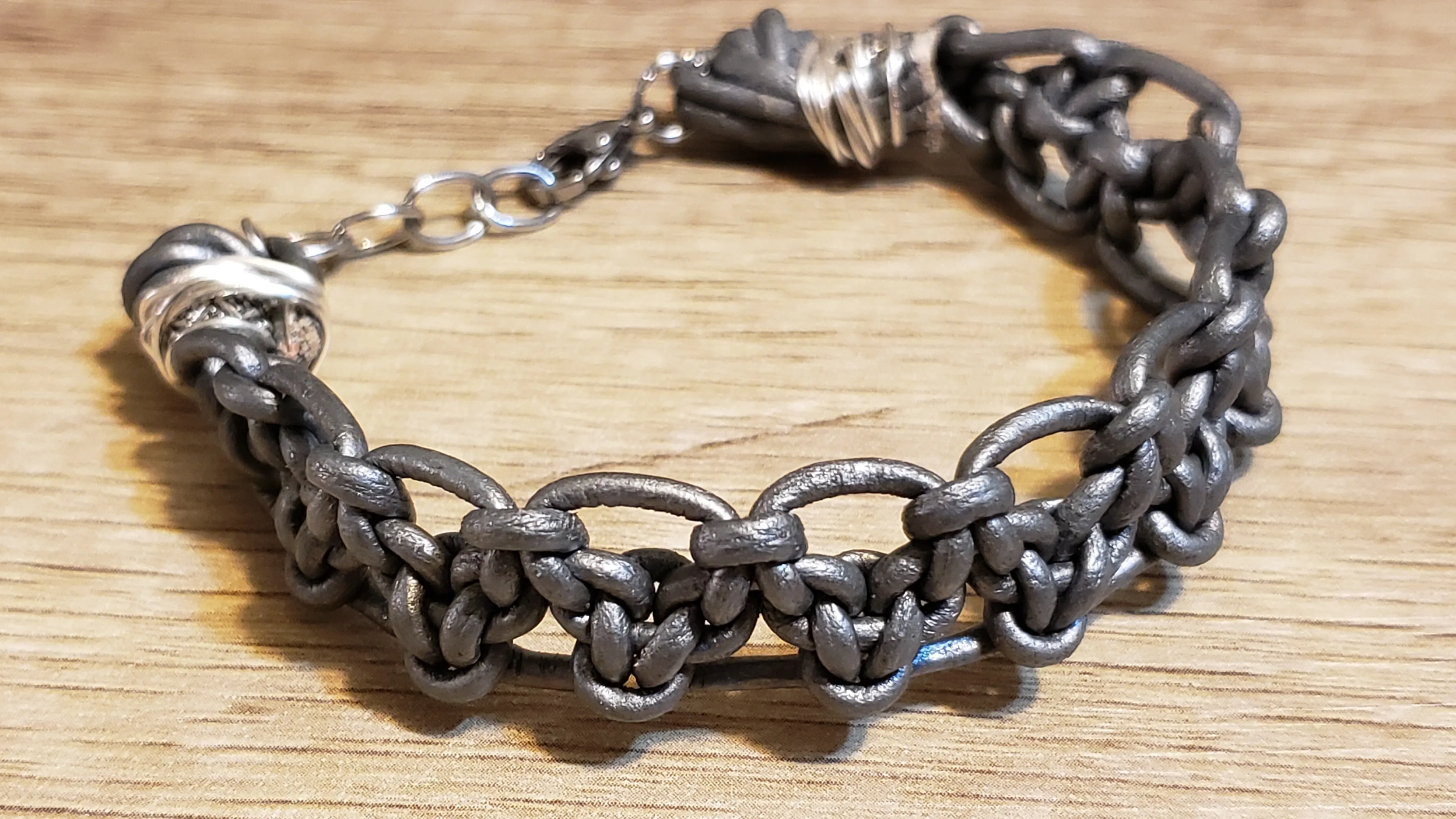 Metallic Gray Leather & Stainless Steel Chain Bracelet, Adjustable up to 9" with Lobster Claw Clasp.
 